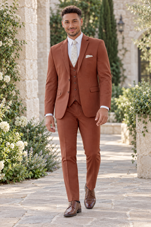 "The Metro" Men's Slim Fit Rust 3 Piece Suit shown in professional outdoor wedding photography