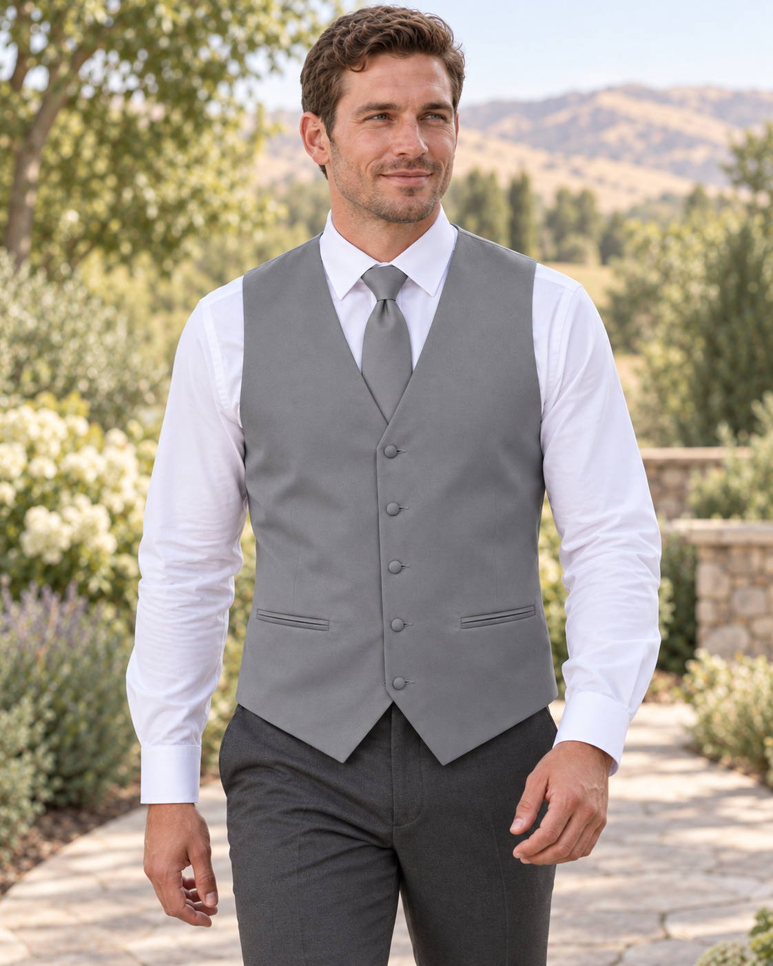 Platinum satin vest with coordinating necktie on a model in an outdoor Idaho wedding setting
